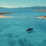 Aerial view of our boat anchored at Panteronisia, the famous Blue Lagoon Paros boat destination accessible only by sea with Don Blue Yachting.