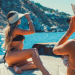 Capturing perfect Greek summer shots on board, as friends share unforgettable moments during a private cruise with Don Blue Yachting.