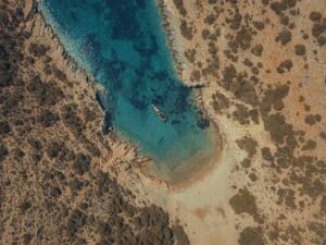 The secluded bay of Almyria where the Herakleia island shipwreck lies, offering calm turquoise waters for a perfect yacht stop.