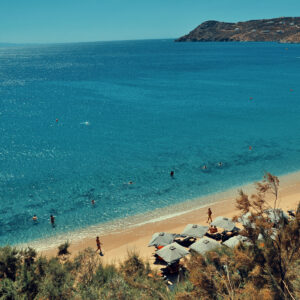 Approaching the golden sands of Agrari beach by sea, the most comfortable way to visit the best Mykonos beaches with Don Blue Yachting.