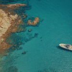 Experience the vibrant energy of south coastline from the privacy of your yacht, a highlight of any tour to Mykonos beaches.