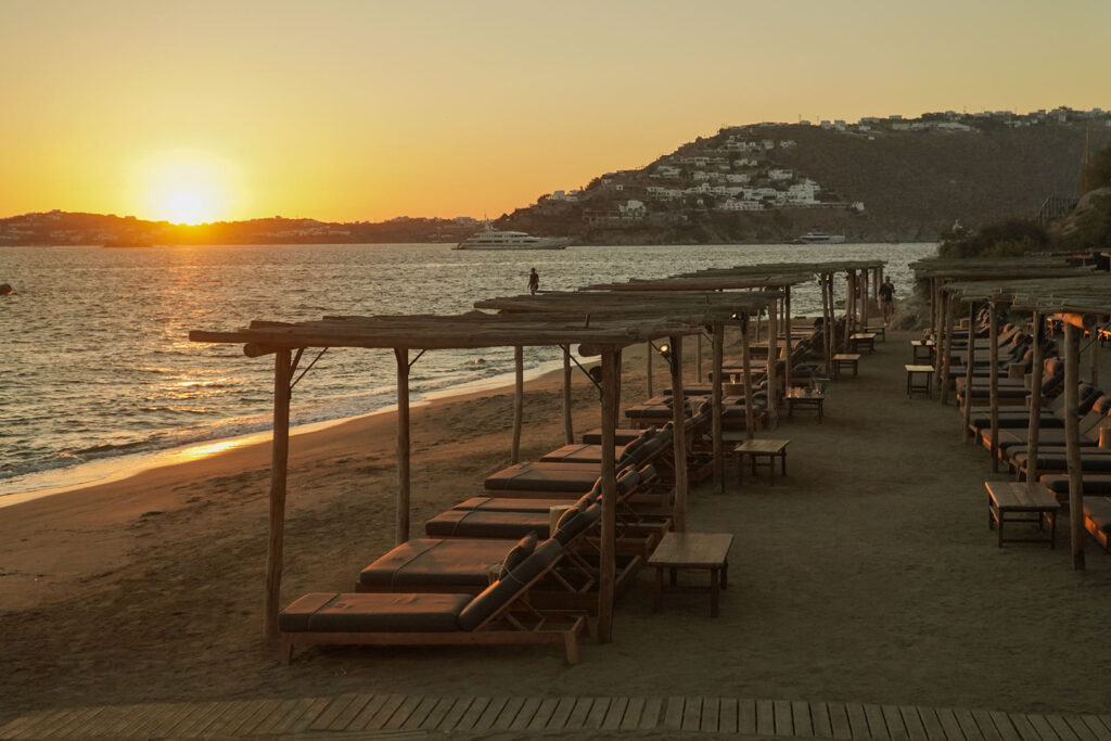 Golden hour views and the famous sunset at Scorpios Mykonos, a must-see stop on our private boat tours.