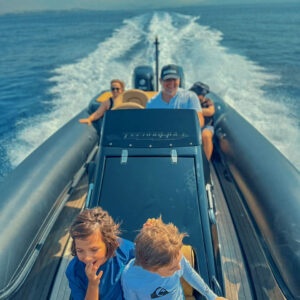 A family traveling in total safety and comfort during our private boat transfers, enjoying a smooth, stress-free ride between the Greek islands.