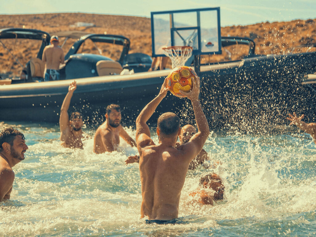 Group water activities on inflatable toys, creating laughter and shared memories for a memorable team getaway during corporate retreats at sea.