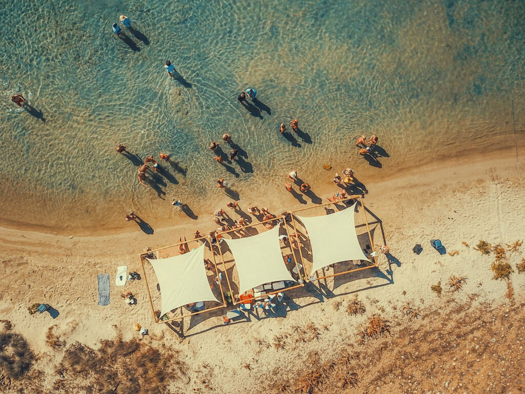 A fully organized private beach setting, transformed into an exclusive venue for corporate retreats at sea by the Don Blue Yachting events team.