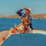 A romantic moment on deck with premium wine, the perfect way to unwind while following our curated Schinousa island guide.