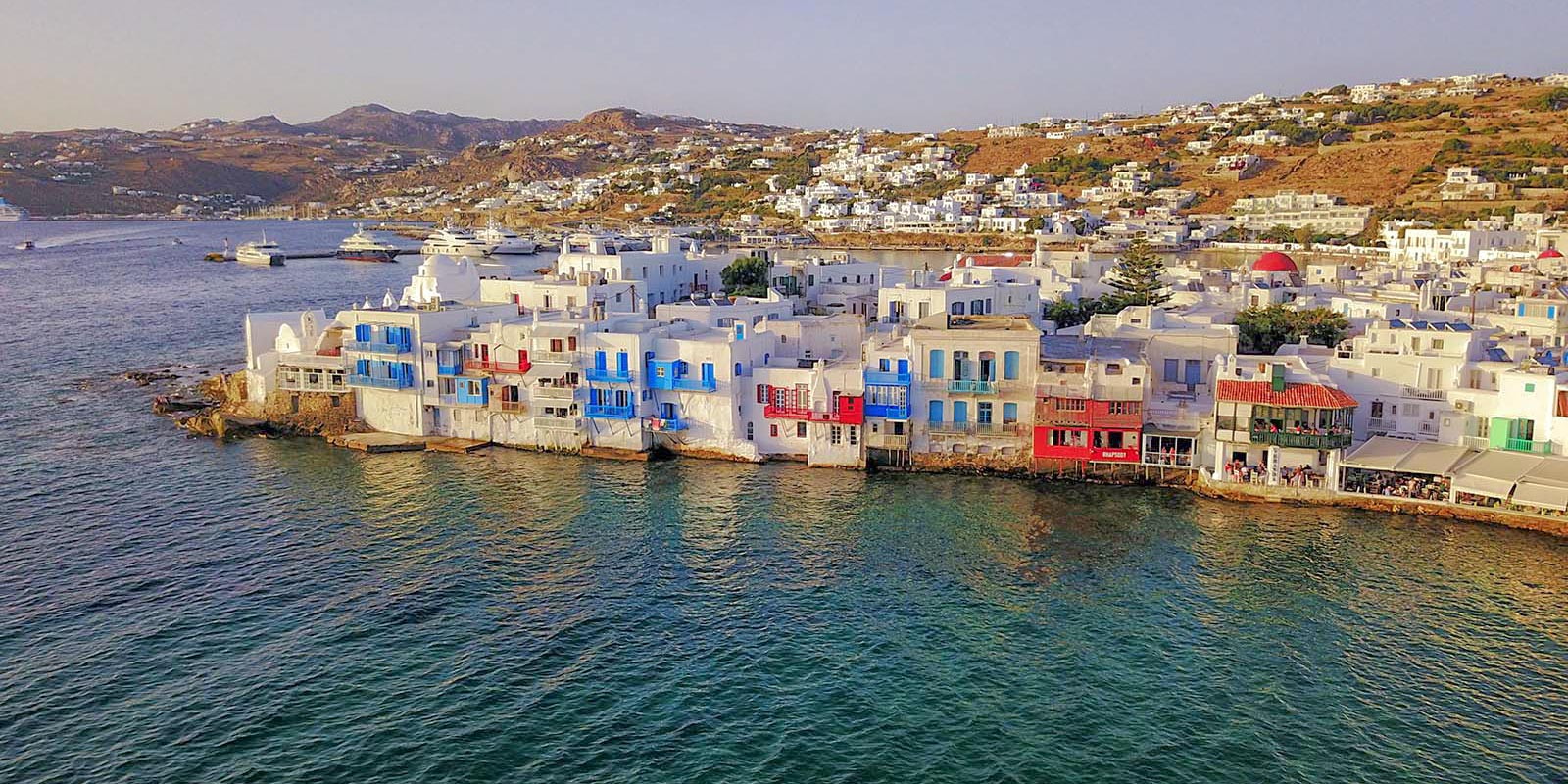 Sunset over the historic houses of Little Venice Mykonos.