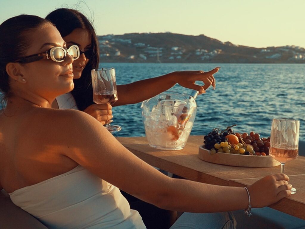 A private boat approaching the shore of Little Venice Mykonos