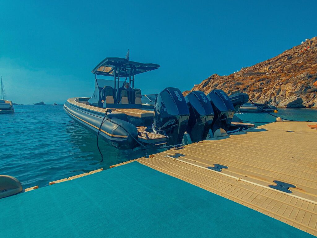 A Don Blue luxury yacht anchored near the best Mykonos beach clubs by boat.