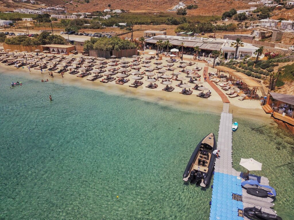 Guests docking at Solymar beach bar, one of the best Mykonos beach clubs by boat.