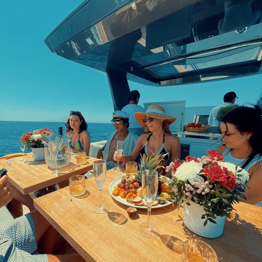Guests enjoying a private party on a Don Blue boat for Easter in Mykonos.