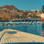 Panoramic view of Psarou beach and famous Nammos club Mykonos restaurants by boat