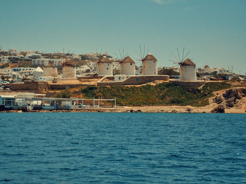 Golden hour light hitting the iconic Windmills of Mykonos.