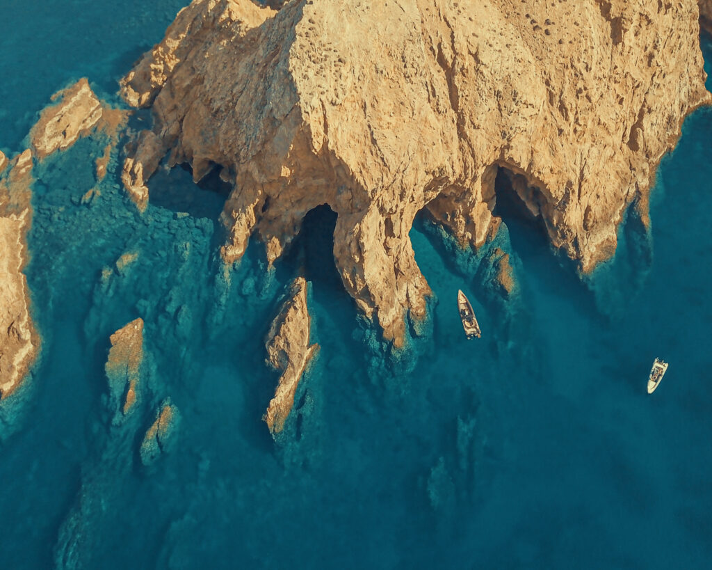 Snorkeling in the crystal-clear emerald waters of the Natura 2000 sanctuary during a Dragonisi Mykonos Tour