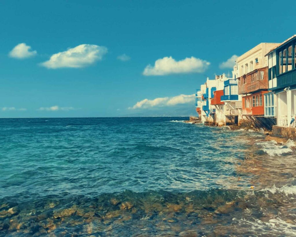 conic Little Venice Mykonos viewed from a Don Blue Yachting private boat — a perspective most visitors in the Paros vs Mykonos debate never get to see