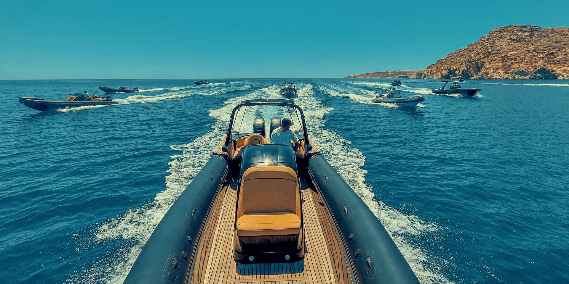 The Don Blue Yachting fleet cutting through the Aegean during the Kayali event Greece transfer between Mykonos and Tinos