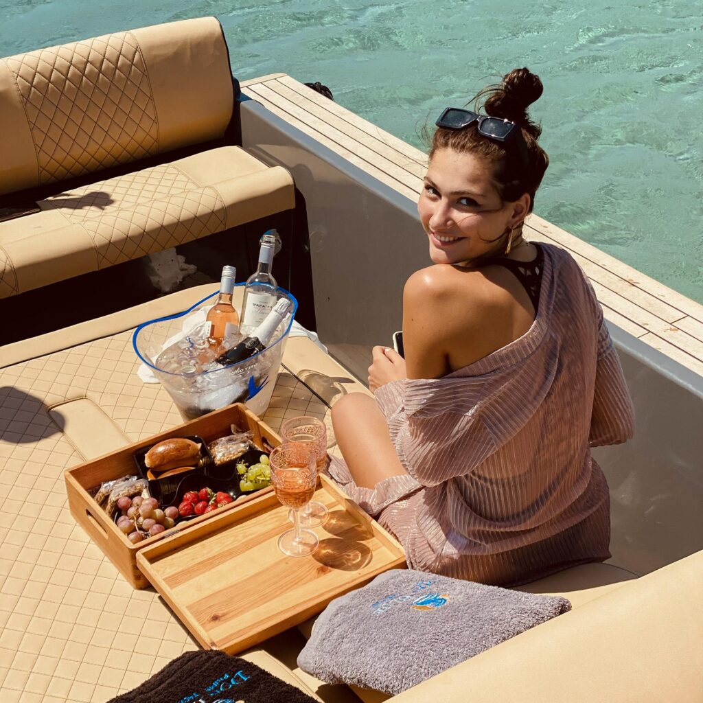 Fresh fruits and refreshments served as part of the Mykonos sunbed prices vs private boat experience.