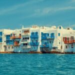 Iconic Little Venice Mykonos bathed in golden light — a must-stop on any one day in Mykonos itinerary with Don Blue Yachting