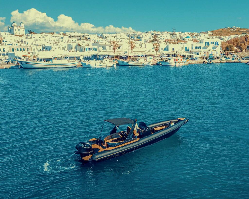 Don Blue Yachting private boat anchored in the sparkling waters of Naoussa Paros — the effortless chic side of the Paros vs Mykonos experience