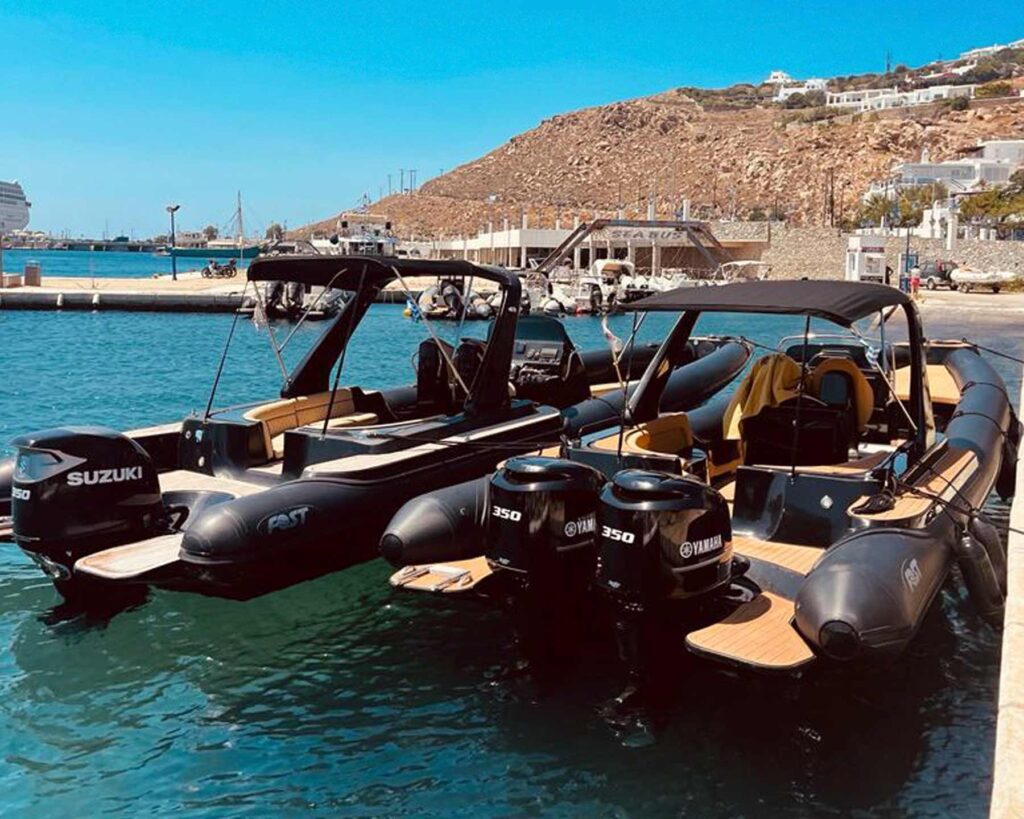 Two Don Blue Yachting private boats ready at the dock waiting for guests — your departure point for a day that completely avoids the crowds in Mykonos.