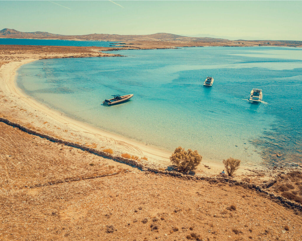 Pristine beaches of Rhenia island near Mykonos enjoyed during Camila Cabello's Don Blue Yachting private cruise