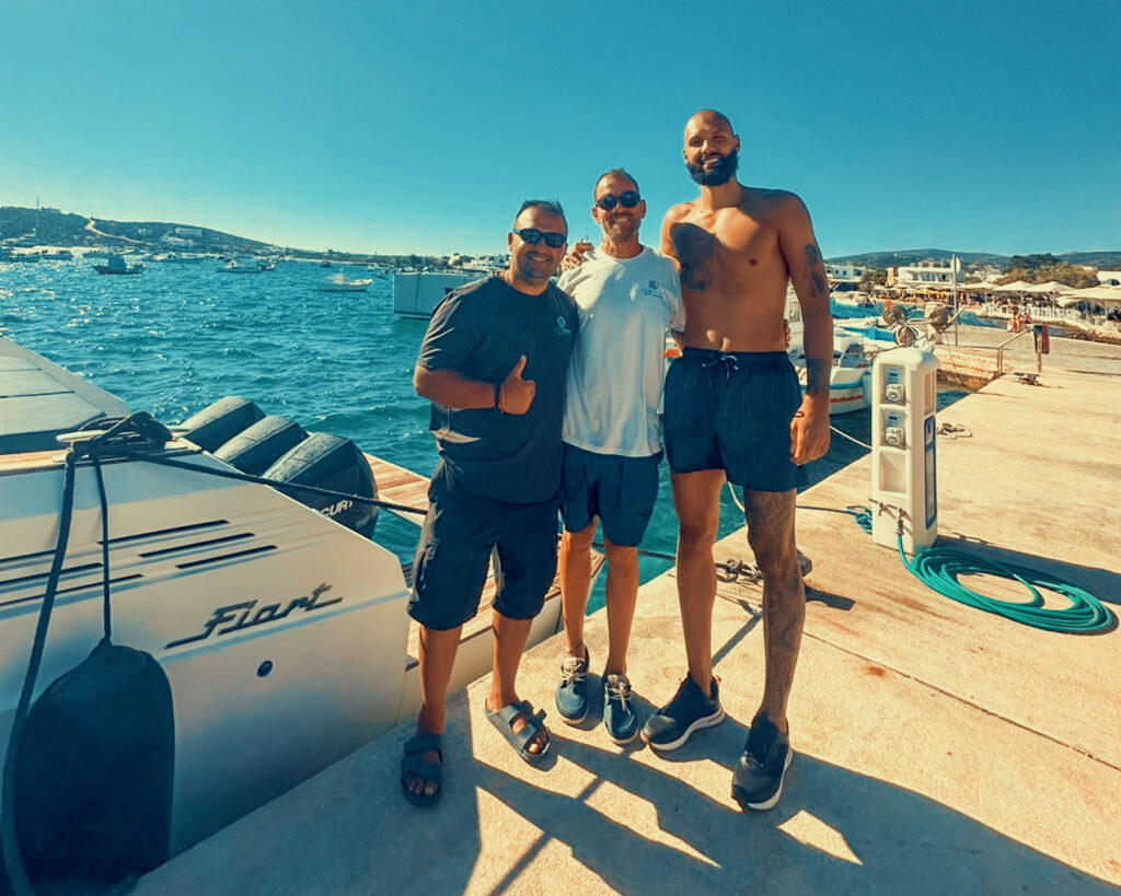 Evan Fournier with the captains of the Amphitrite and the accompanying RIB — the Don Blue Yachting crew that made his private cruise experience in Greece possible