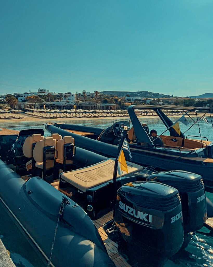 Don Blue Yachting boats positioned in front of Crios Beach Restaurant Paros during the Ferrari Cavalcade 2026 Greece exclusive lunch event