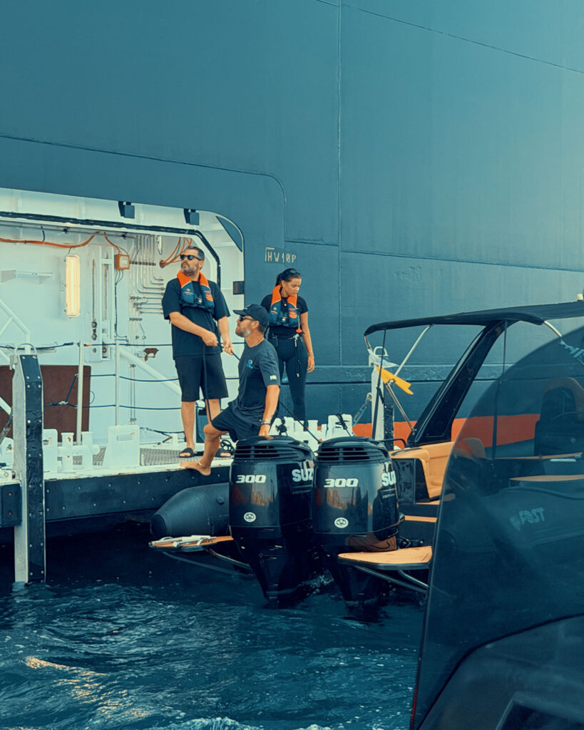 Don Blue Yachting crew members on board the EXPLORA II coordinating the VIP guest transfer for the Ferrari Cavalcade 2026 Greece Paros operation