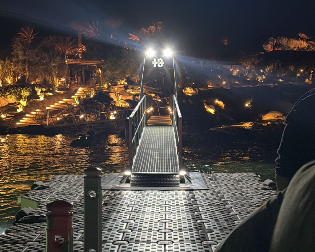 View from the Scorpios Mykonos floating stage toward the venue entrance during the PAWSA sold-out Music Ritual on July 19 2026 with Don Blue Yachting as the official sea transfer partner