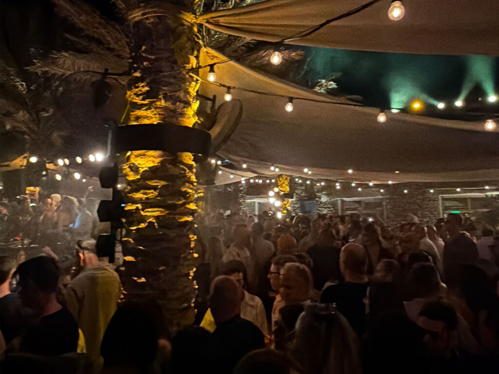 Inside Scorpios Mykonos packed with guests during the Rampa Music Ritual — with Don Blue Yachting handling the official sea transfers for the night