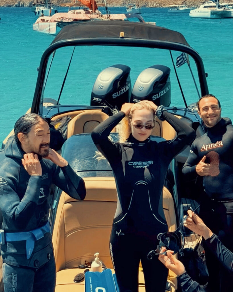 Steve Aoki and crew snorkelling in the crystal clear waters of Rhenia island near Mykonos with Don Blue Yachting