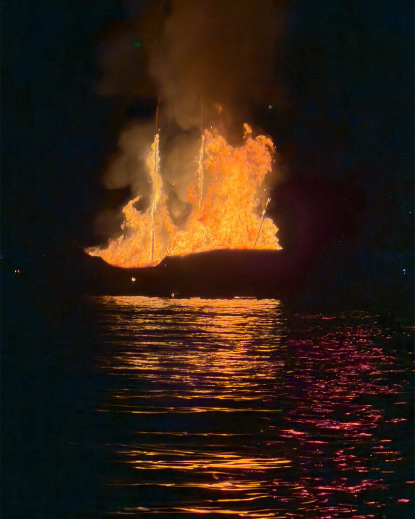 Armata Spetses fireworks reflected in the harbour water seen from a Don Blue Yachting private boat