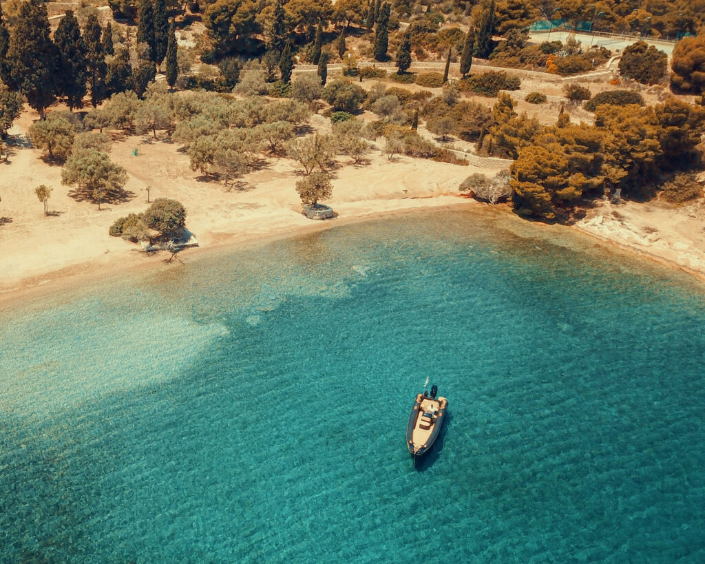 The pine-forest bay of Zogiria on Spetses visited on a Don Blue Yachting day cruise during the Armata Spetses festival period